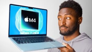 Thumbnail image of Marques Brownlee holding the M4 MacBook Air in a sleek modern setting, with a confident expression, showcasing the laptop's thin design and sleek finish.