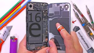 Thumbnail image of the iPhone 16e being bent by hands, showcasing a durability test with visible pressure points on the device.